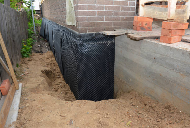 Happy homeowners after waterproofing job in New Market